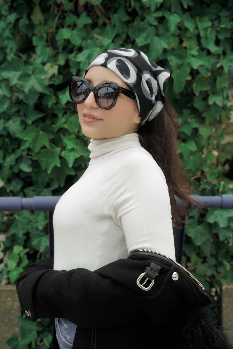 Audrey headscarf in black from silky upcycled material on model